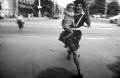 People run across an intersection to avoid sniper fire during the siege on Sarajevo by Serb troops. Around 250,000 people lost their lives in the conflict between Bosnian Muslims, Croats and Serbs that raged from 1992 to 1995 and resulted in the break-up of the former Yugoslavia.