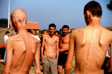 Bosnian and Croatian prisoners of war at the prison camp in Trnopolje, Bosnia, Aug. 23, 1992. All sides of the Bosnian conflict ran prison camps, where many people were killed, and several commanders were later indicted for war crimes.