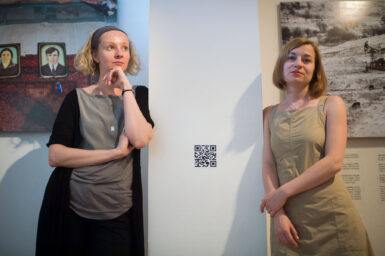 Curator Anna Shpakova (L) and artist Olga Kravets during a photo opportunity at the 'Grozny Nine Cities exhibition part of the First World WARM (War Art Reporting Memory) festival in Sarajevo on July 1, 2014. 'Grozny Nine Cities' is a joint project by Olga Kravets, Maria Morina, and Oksana Yushko, exploring specific aspects of GroznyÕs aftermath through considering them as ÒcitiesÓ hidden within Grozny. Exhibition partner Prix Bayeux.