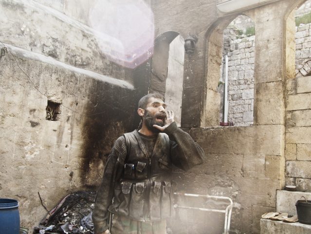 Aleppo, Syria. March, 2013.
A Syrian rebel fighter yells "God is Great" during close quarters fighting with forces loyal to Bashar al-Assad in Aleppo's Old City.