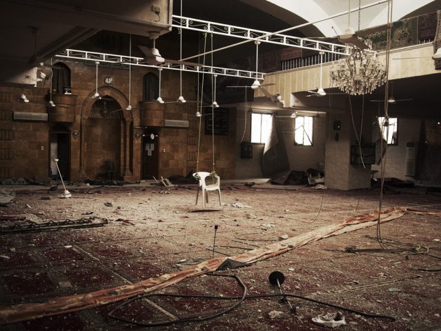 Aleppo, Syria. March, 2013.A makeshift swing made with a plastic chair remains inside a mosque that was occupied by Syria Army soldiers in the front line of the Salahedin district of Aleppo.