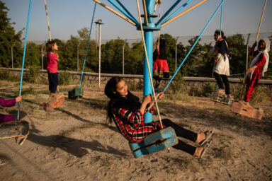 KABUL | AFGHANISTAN | 8/5/18 | Zarina (14) plays with her friends and neighbors at marastoon's playground. Zarina is often quiet and doesn't express her feelings but she has enormous amount of rage against her mother. Qalam Nesa, who has survived three attacks as a child, that she recalls as “airplanes dropping bombs”, suffers from an undiagnosed, yet, extreme mental disorder. She was first married off when she was 13 and has been married twice more since then. She has good days and bad days. On her good days, she’s active, sings, dances, sews and goes out. On her bad days, she sits in a corner and cries non-stop, starts a fight with other women or her kids at the house or the staff at marastoon.