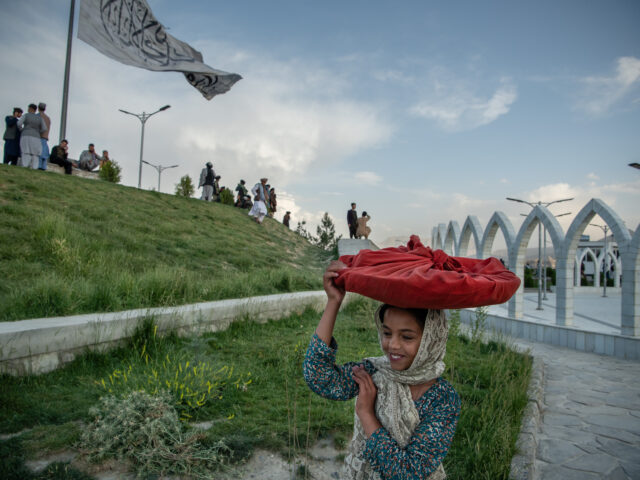 KABUL | KABUL | AFGHANISTAN | 5/20/22 | The only female presence on Wazir Akbar Khan hill, was 12 year old Nazila who was selling bolani (a afghan snack, fried bread stuffed with either potatoes or leeks) to visitors of the park, mostly Taliban fighters.