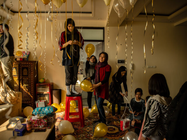 KABUL | KABUL | AFGHANISTAN | 2/6/21 | Foroohar (19) decorates their living room in preparation for a surprise birthday party for her younger sister, Farangis. The family has arrange for friends and relatives, all women, to come together before Farangis make an entrance.
In the last 20 years, an entire generation of largely urban Afghans have grown up with all the basic liberties that the Taliban had erased during the rulings in the 90s. Now they are gripped by fear that all those rights they've gained could be at risk.