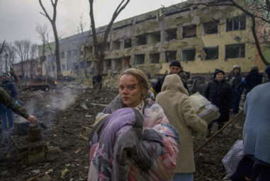 Marianna Vishegirskaya stands outside a maternity hospital that was damaged by shelling in Mariupol, Ukraine, Wednesday, March 9, 2022. Vishegirskaya survived the shelling and later gave birth to a girl in another hospital in Mariupol. (AP Photo/Mstyslav Chernov)