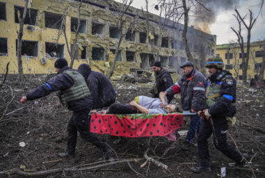 Ukrainian emergency employees and volunteers carry an injured pregnant woman from a maternity hospital that was damaged by shelling in Mariupol, Ukraine, March 9, 2022. The woman and her baby died after Russia bombed the maternity hospital where she was meant to give birth. (AP Photo/Evgeniy Maloletka, File)