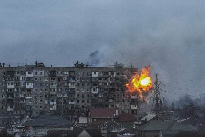 An apartment building explodes after a Russian army tank fires in Mariupol, Ukraine, Friday, March 11, 2022. (AP Photo/Evgeniy Maloletka)