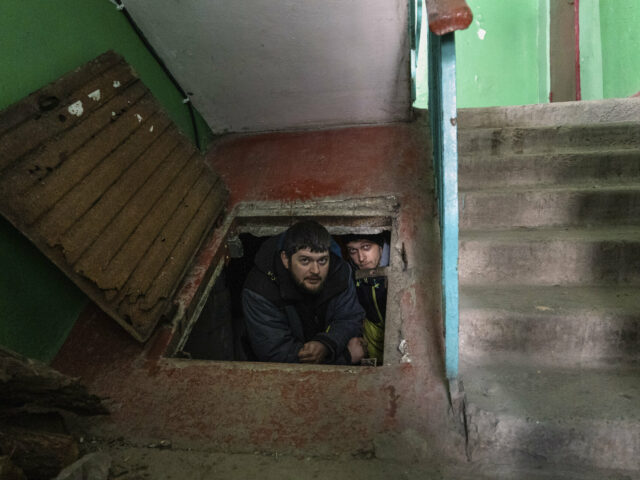 People take shelter from shelling in the basement in Mariupol, Ukraine, March 12 2022.