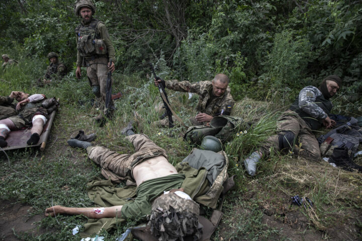 OUTSIDE OF LYSYCHANSK,UKRAINE-JUNE 26: Wounded soldiers of the Ukrainian Airborne unit are treated outside the embattled city of Lysychansk, Ukraine on June 26,2022. Eight soldiers were wounded, two seriously, A Russian cluster bomb attack hit them as they moved into the farm village of Verkhniokamianske.

The Ukrainian Airborne unit was relieved to be pulling away from the front Sunday morning, riding a column of armored personnel carriers away from the embattled city of Severodonetsk, which had already fallen to the Russians, and Lysychansk, which was on the brink. (Photo by Heidi Levine for The Washington Post).