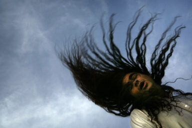 An Iraqi Dervish prays during a gathering outside their Tekiyah, a place of worship, in Baghdad, May 29, 2003. Swaying gently at first, chanting in monotones, the Dervishes slowly build up to a frenzy of prayers. Dervishes are Sufis, a spiritual offshoot of Islam, who believe their bodies open up to the energy of God when they are in prayer.