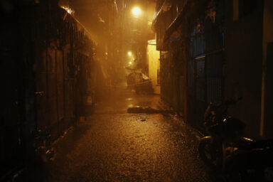 Heavy rain pours as the body of Romeo Joel Fontanilla is left in a narrow alley in Manila, Philippines early October 11, 2016. Romeo Joel Fontanilla, who was, according to the police, a known drug user and pusher was shot dead by three motorcycle riding gunmen. Damir Sagolj