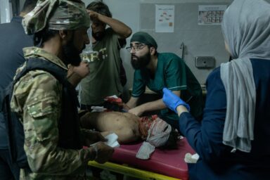 Fadi (13) receives treatment for his injuries at the NationalHospital in Deir al-Zour, Syria. The boy was injured and hismother was killed as they scavenged for scrap plastic ata dump site, accidentally detonating an unexplodeddevice, August 21, 2025. Photo by Nicole Tung (VII Photo, for The New York Times)