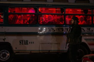 A member of the Internal Security Command, Syria’snational police force, under the Ministry of Interior, patrolsa busy square in the eastern city of Deir al-Zour, Syria, August 20, 2025. Photo by Nicole Tung (VII Photo, for The New York Times)